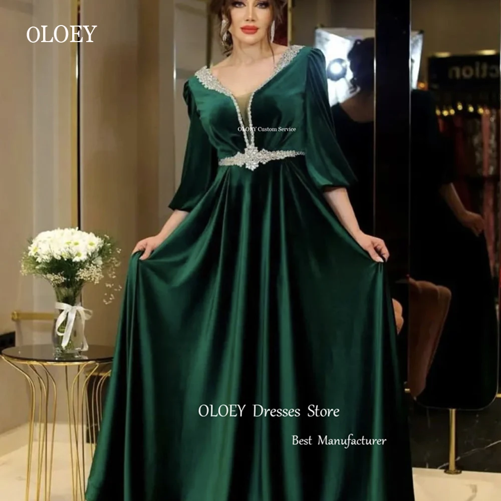 

OLOEY Modest Emerald Green Velvet Satin Dubai Arabic Women Evening Dresses Crystal Belt Neck V Long Sleeves Formal Prom Gowns