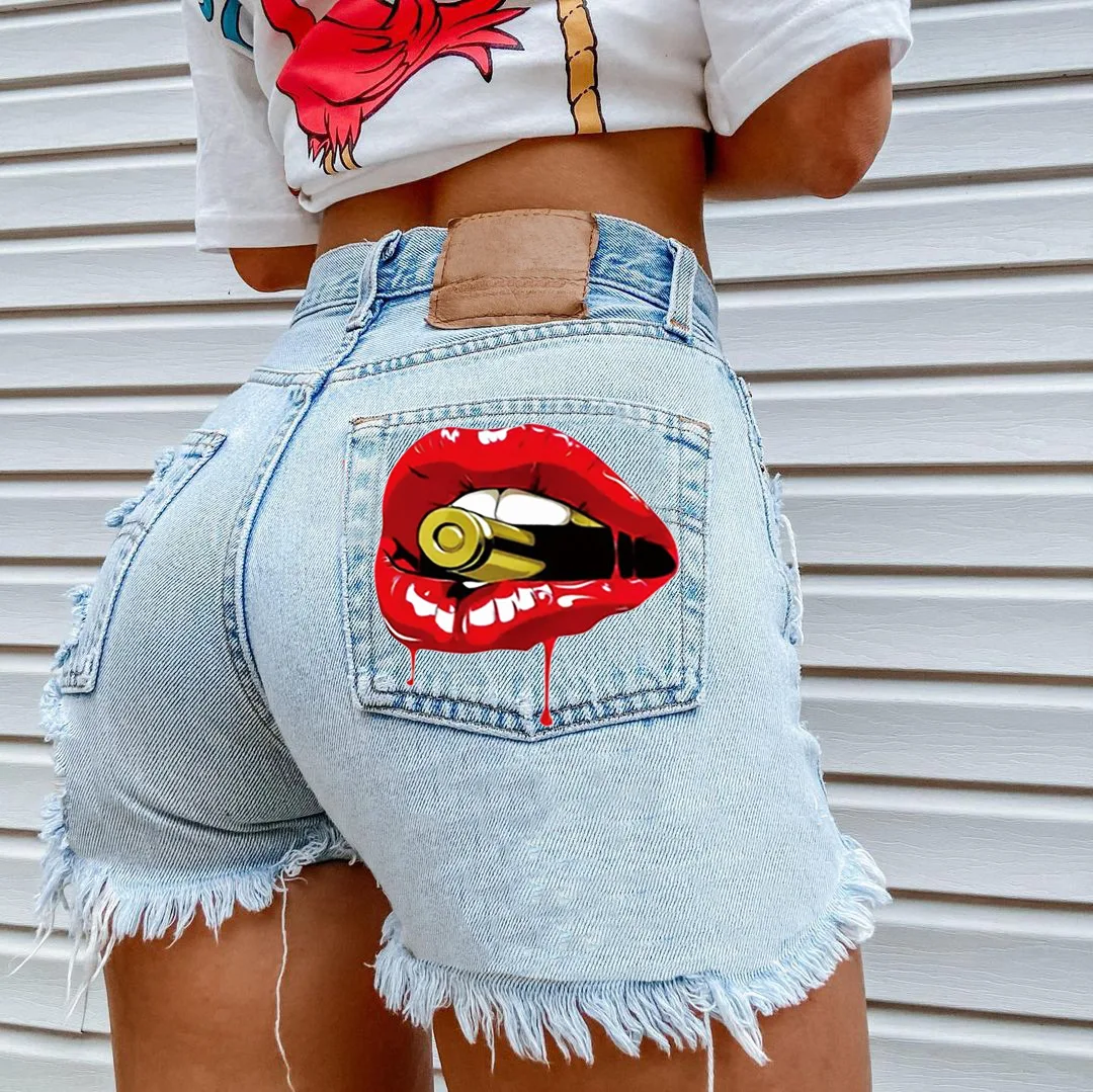 

Women's summer new hot selling street INS explosion style mouth bite bullet print denim hole tassel girl shorts foreign trade