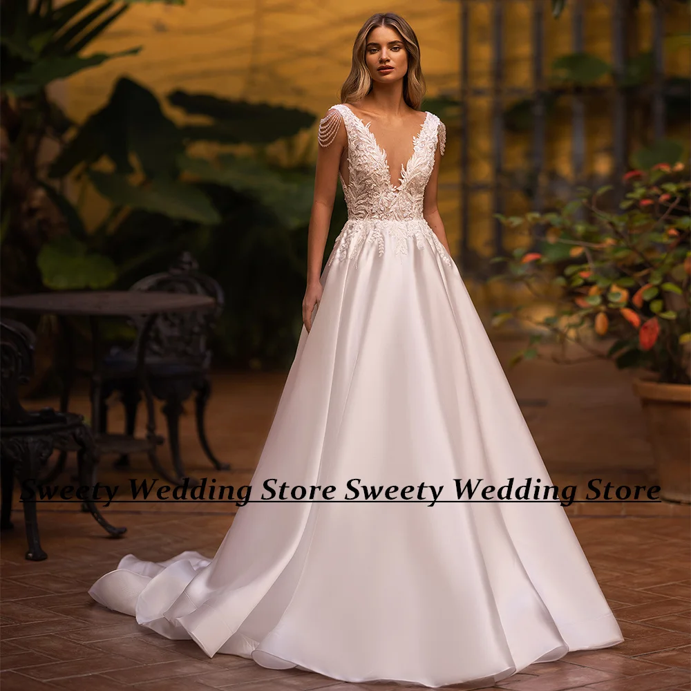 

Jiayigong Modern Satin Wedding Dress for Bride Deep V Neck Beading Sequined Applique Sweep Train Backless A Line Bridal Gown
