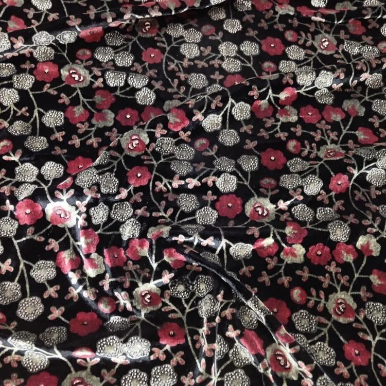 

Shiny velvet blooming red poppies on a dark silk fabric, a dress must