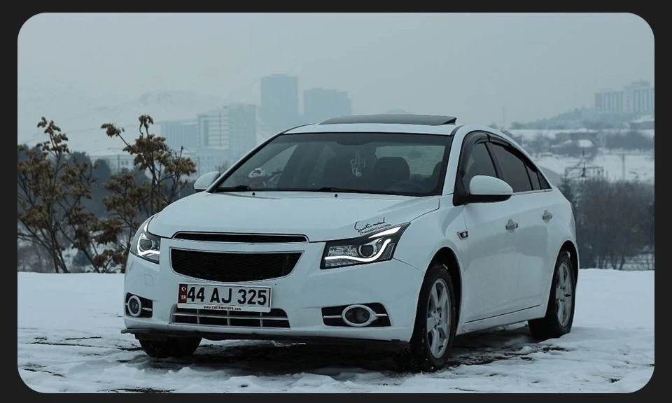 Фото Фара в сборе для Chevrolet Cruze 2009-2014 годов выпуска, с ксеноновыми ангельскими глазками, светодиодными дневными ходовыми огнями, указателями поворота, дальним светом и противотуманными фарами. №4