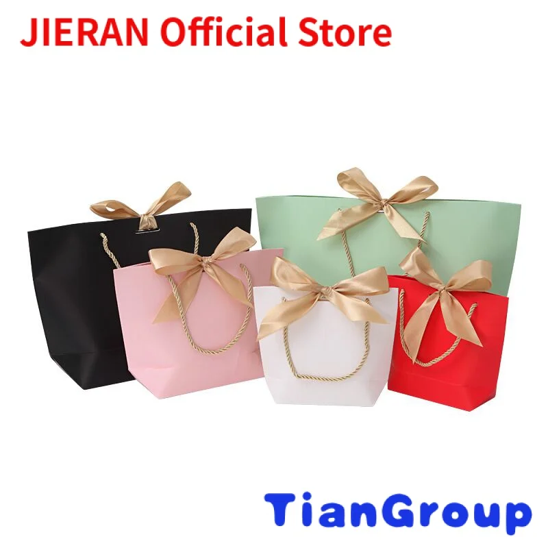 

Wholesale Custom Logo White Paper Gift Bag Ribbon Luxury Wedding Favor Packaging Bag with Foil Gold Logo Printed for Jewelry