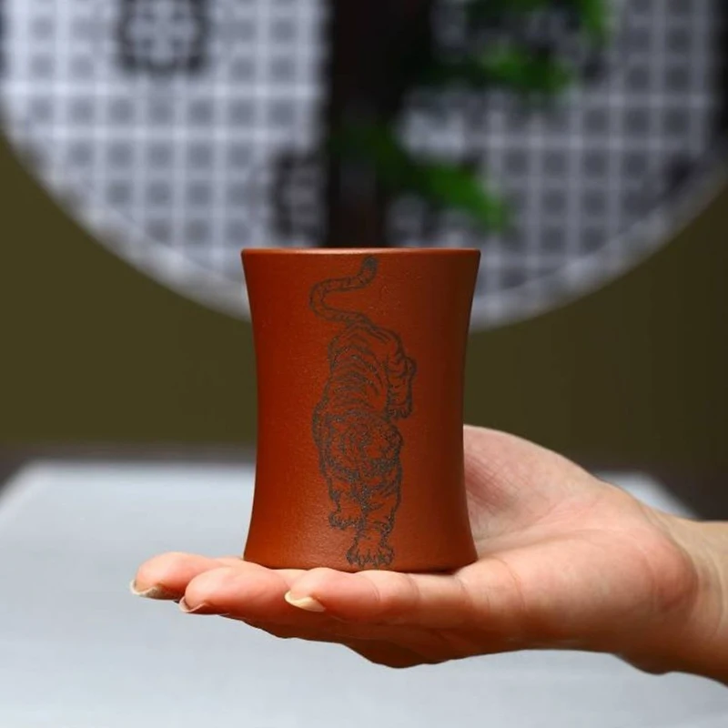 

Yixing purple sand cup raw ore vermilion mud double-sided carving tiger roar cup 1pcs capacity 130ml
