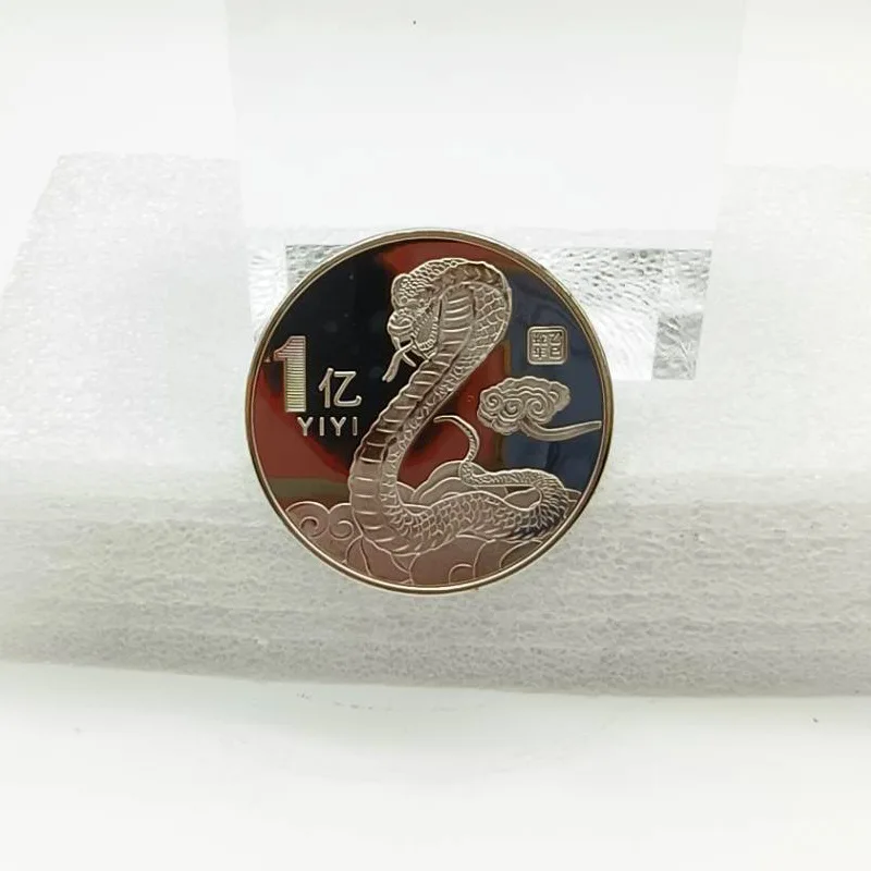 Медная монета в виде змеи