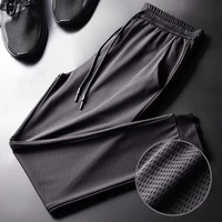 2022 new loose air conditioned pants nine points mesh stretch summer ice silk mens sports casual pants thin trousers fashion