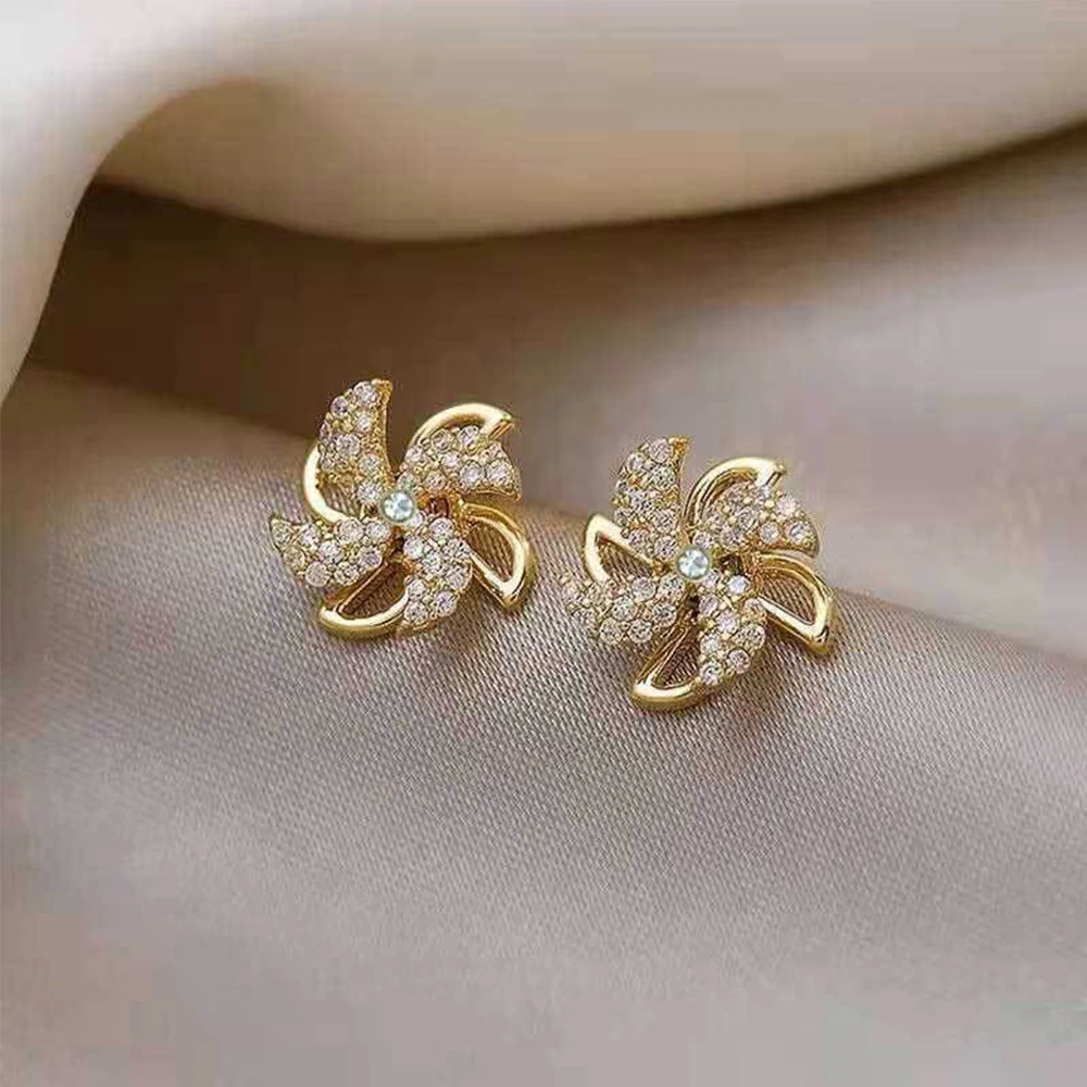 

Copper Inlaid Zircon Rotating Windmill Earrings High-end Simple Temperament Fashion Design Earrings Cерьги