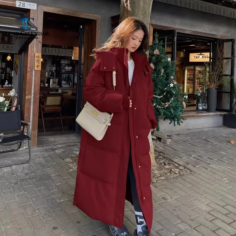 Длинная и толстая женская куртка до колена на утином пуху высококачественная