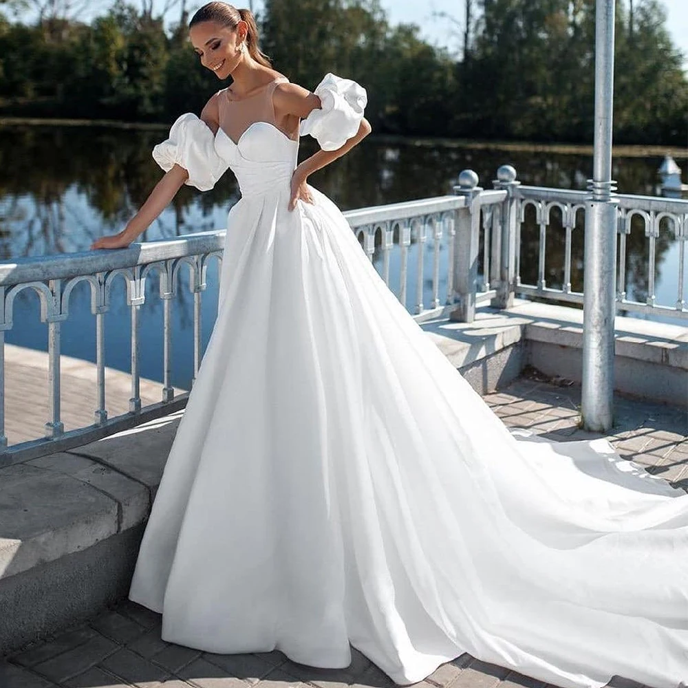 

Round Neck White Wedding Dress Pleated Illusion Back Strap Button Bridal Wedding Dresses Customizable Gowns Event Puff Sleeves