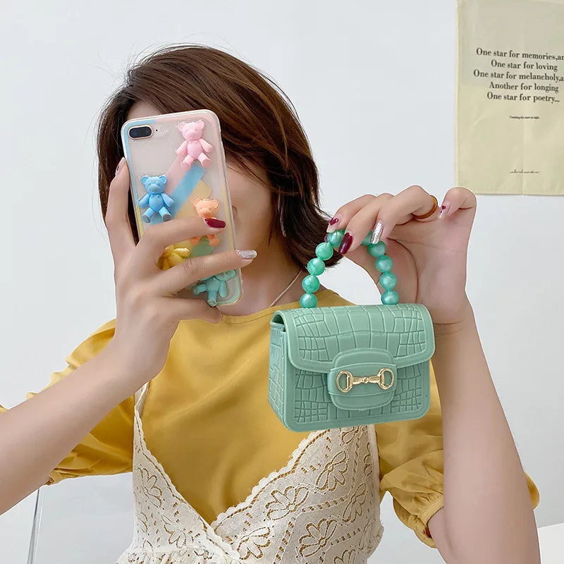 Children 2023 new Pearl color matching magnetic buckle portable mini crocodile pattern small jelly bag strapless red envelope