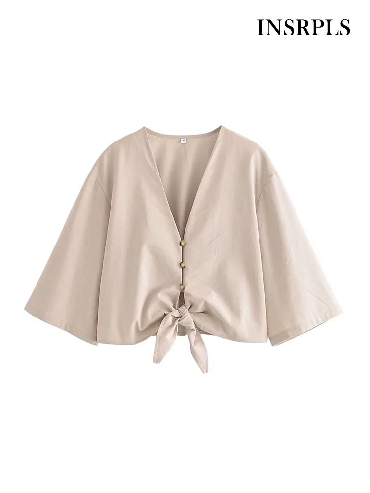 

Женская льняная блузка с V-образным вырезом и рукавом