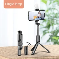 the new portable bluetooth tripod selfie stick mobile phone can be used for live lighting camera bracket dual lamp selfie stick