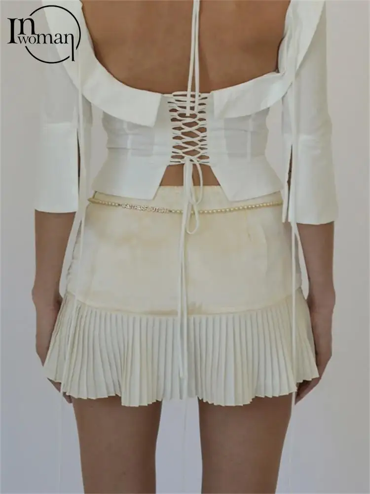 

Мини-юбка женская однотонная составного кроя с рюшами и заниженной талией