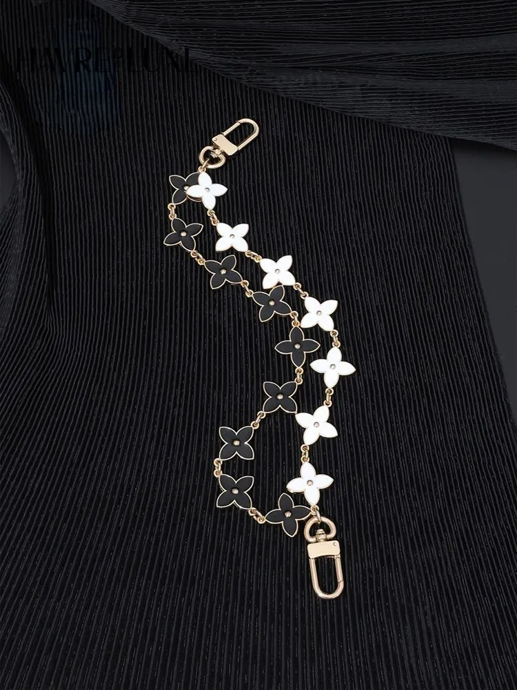 Bag hanging chain double-layer black and white four leaf clover female ornament portable short chain single-purchase accessories