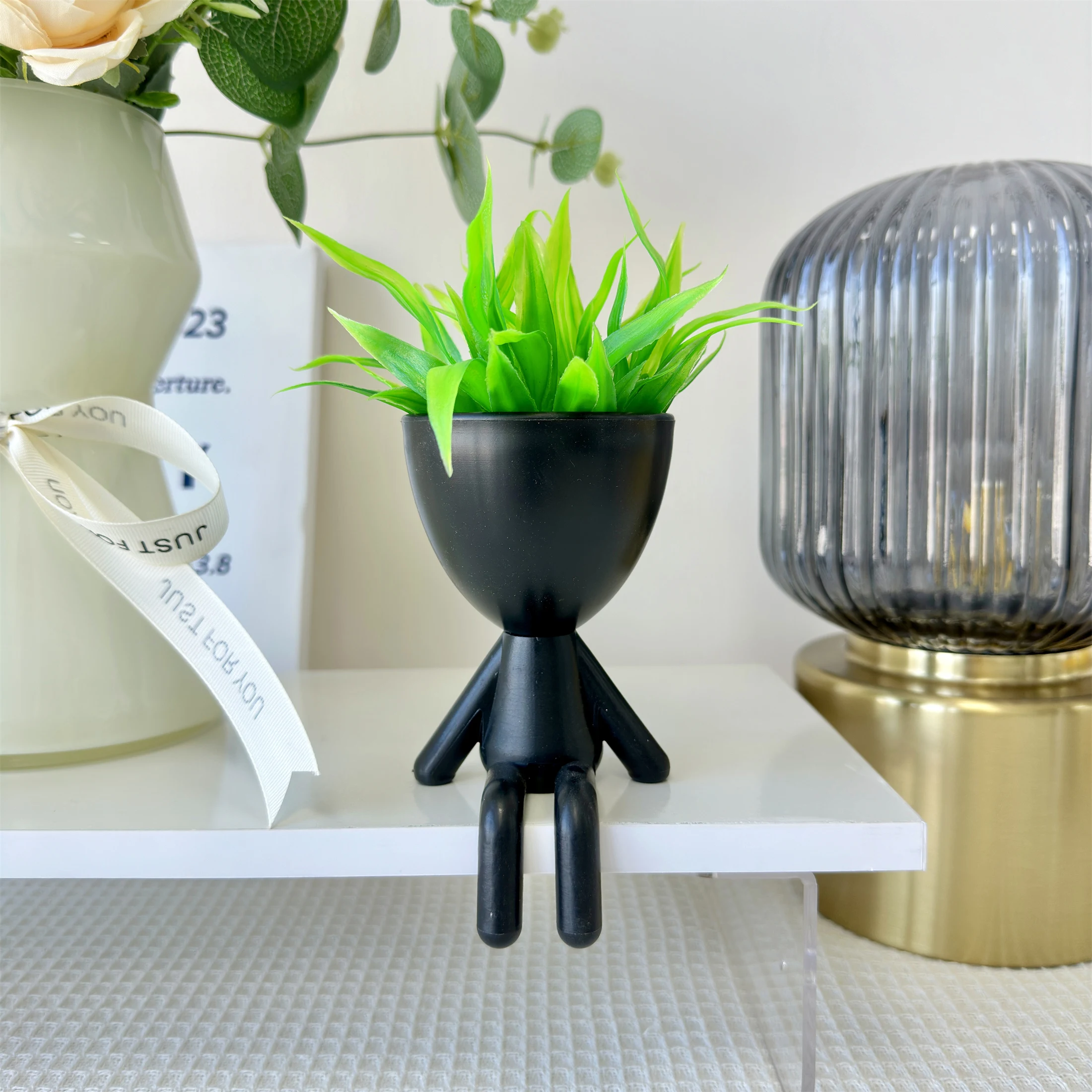 

Искусственное суккулентное растение в форме человека, пластик