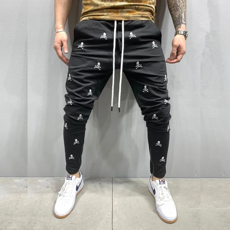 

Мужские новые тактические черные брюки для бега в стиле Харадзюку с вышивкой черепа облегающие повседневные брюки мужские брюки в стиле хип-хоп на молнии для ног