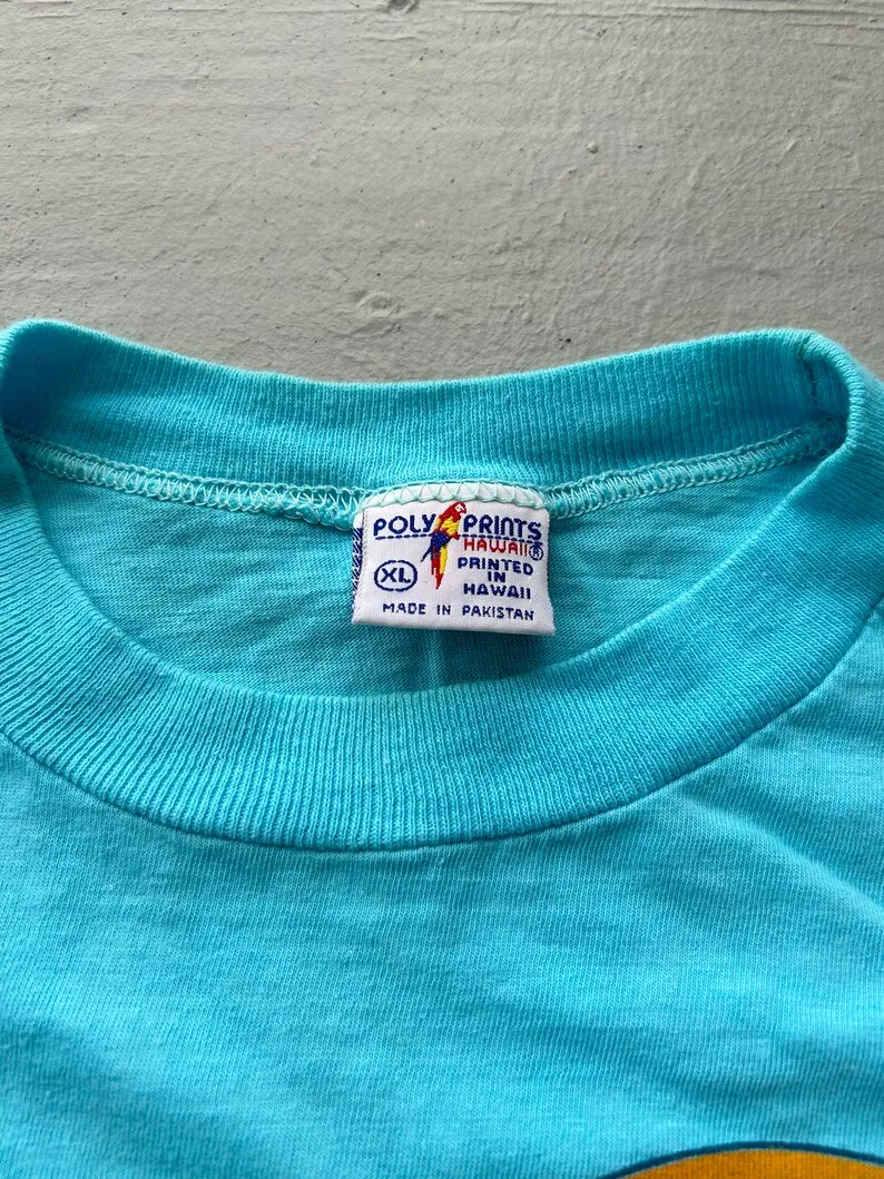 Винтажная футболка Maui Hawaii 80-х годов (XL) голубая с рисунком из полиэстера 1984 года