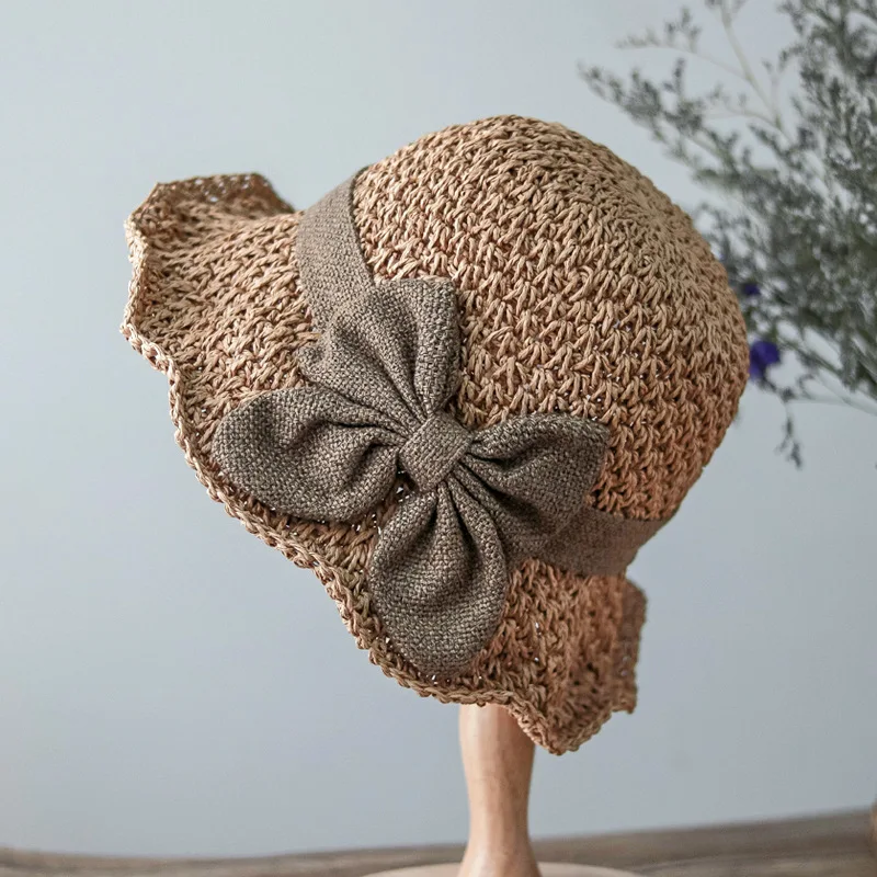

202204-2509270 summer dropshipping hand crochet bowknot paper hat holiday sun cap women leisure cap