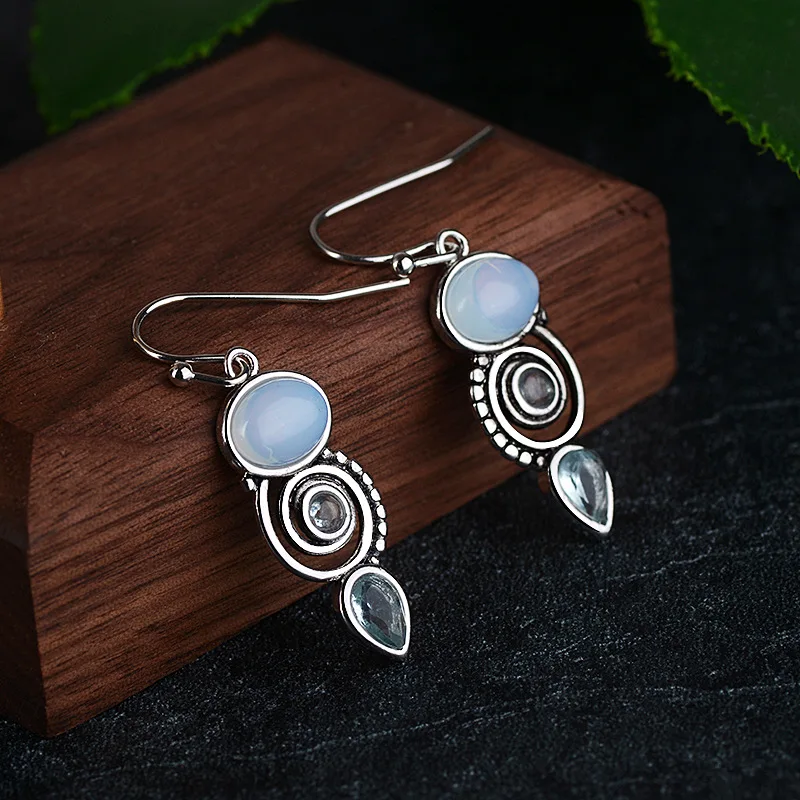 

New Style Inlaid Sea Blue Topaz Earrings European Beauty Creative Rotating Water Drop Pear-shaped Earrings
