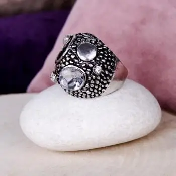 

Silver colored ring with stone