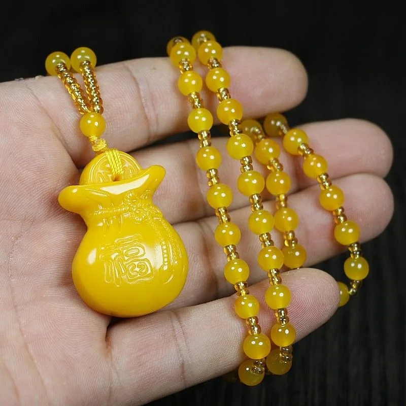 У Huanglong Jasper имелся раньше от поколения до мужские и женские ожерелья с монетами