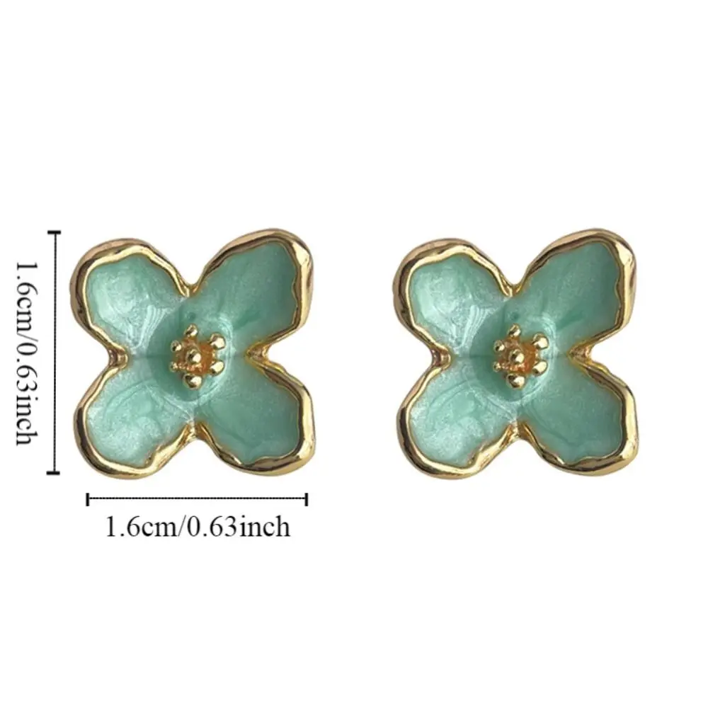 Геометрические серьги-гвоздики мятно-зеленого цвета модное нишевое шикарное