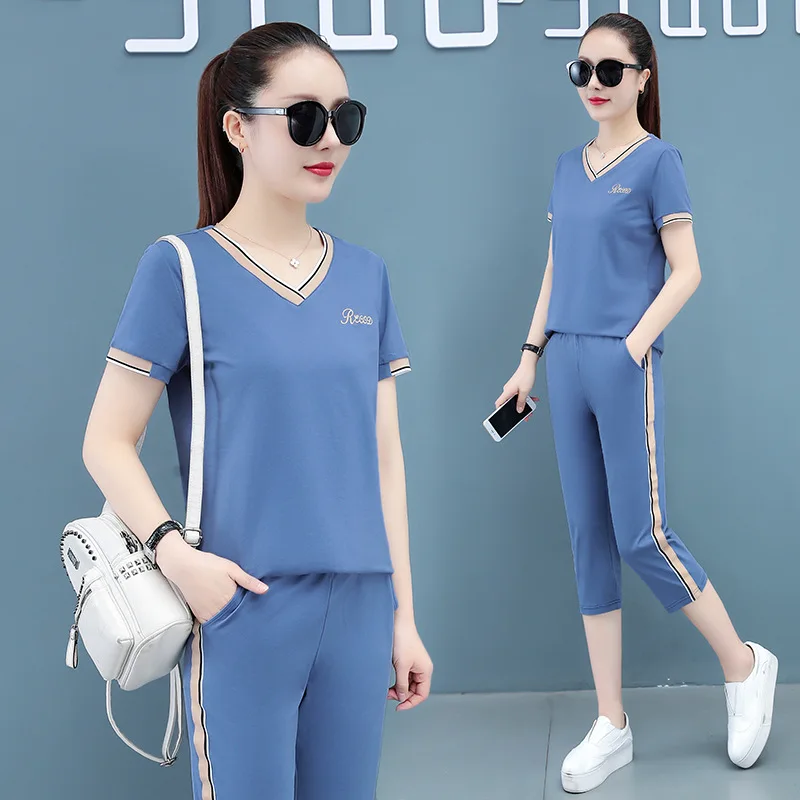 

Летний Новый Женский Повседневный Спортивный костюм, женская летняя одежда, черные, синие укороченные брюки с коротким рукавом pnk, из двух п...