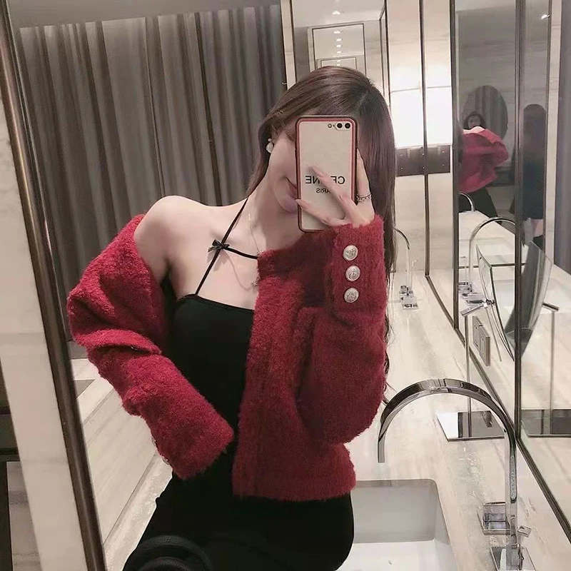 Женский трикотажный жилет с открытыми плечами и бантом |