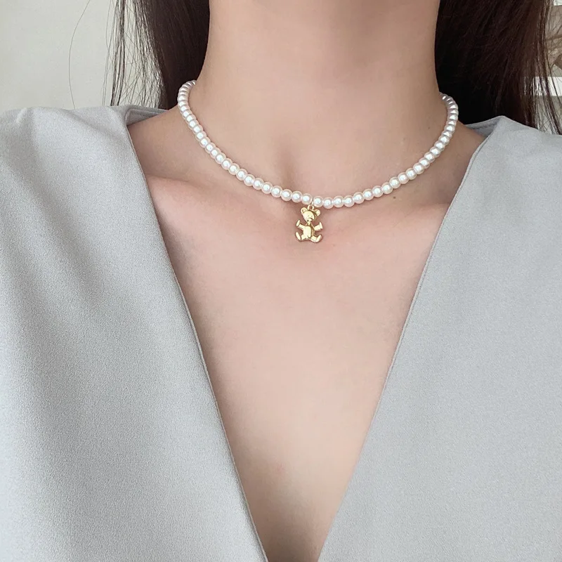 

Retro Fashion Temperament Pearl Simple Metal Bear Heart-shaped Cross Pendant Short Necklace Inlaid Zircon Clavicle Chain Female