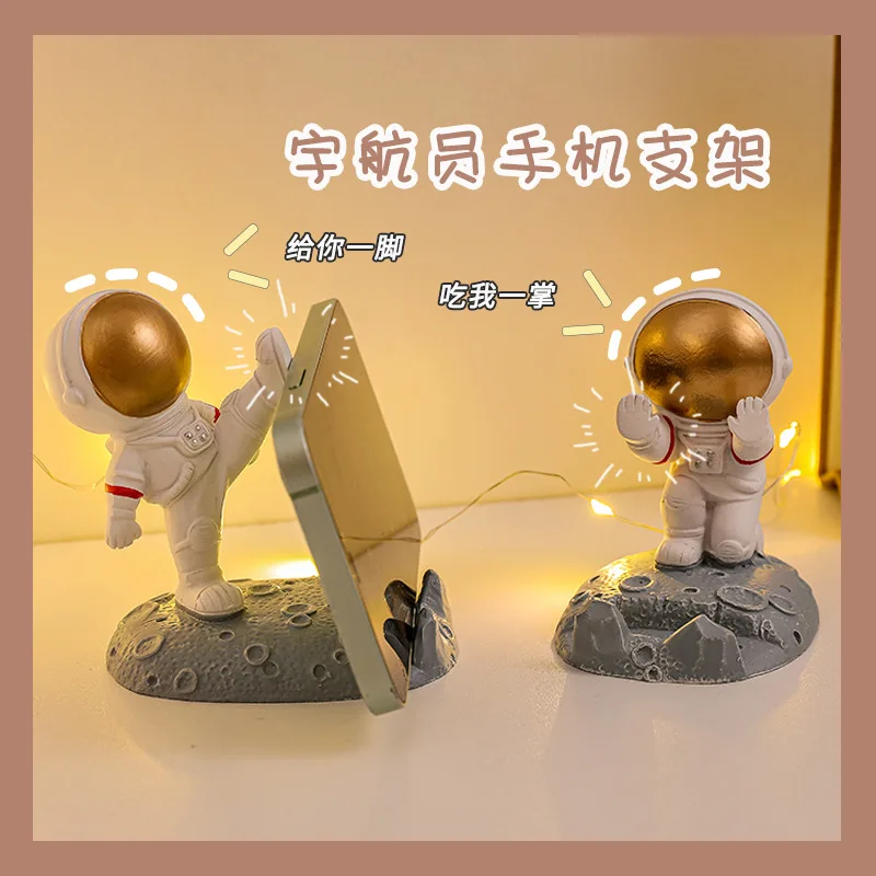 

Resin Astronauts Ornaments Universal Cell Mobile Phone Stand Holder Spaceman Bracket for Home Office Desk Decor Birthday Party