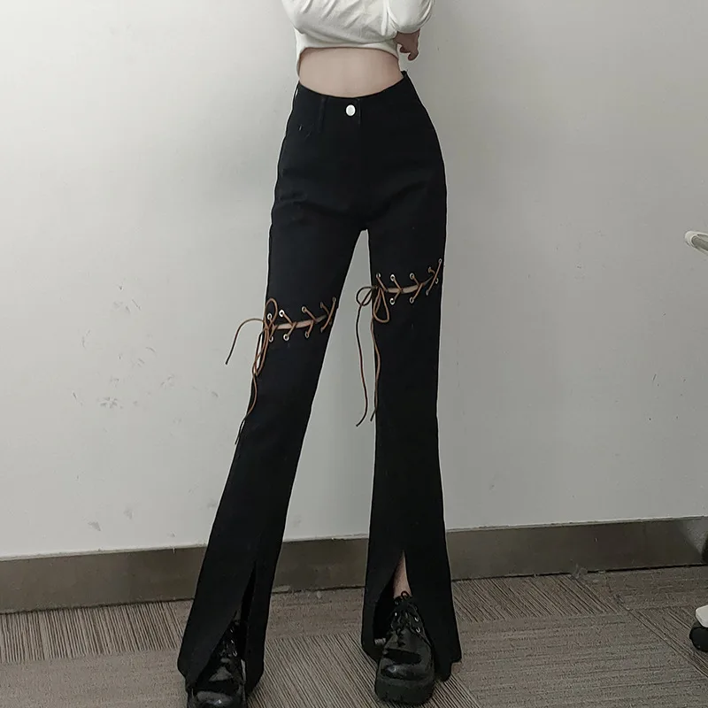 

Women's trendy personality design hollowed-out straps solid color high-waisted slim-fit slit micro-bladed jeans