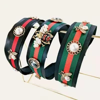 2022 new ladies novelty fashion metal color bee headband red and green striped contrast color wide edge metal bee pearl hairband