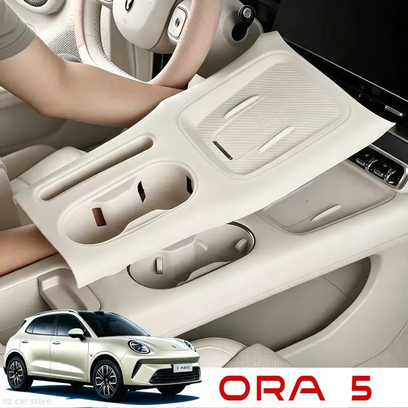 Фото Для GWM ORA 5 2026: силиконовая подставка для беспроводной зарядки, органайзер для подстаканника, аксессуары для салона. №1