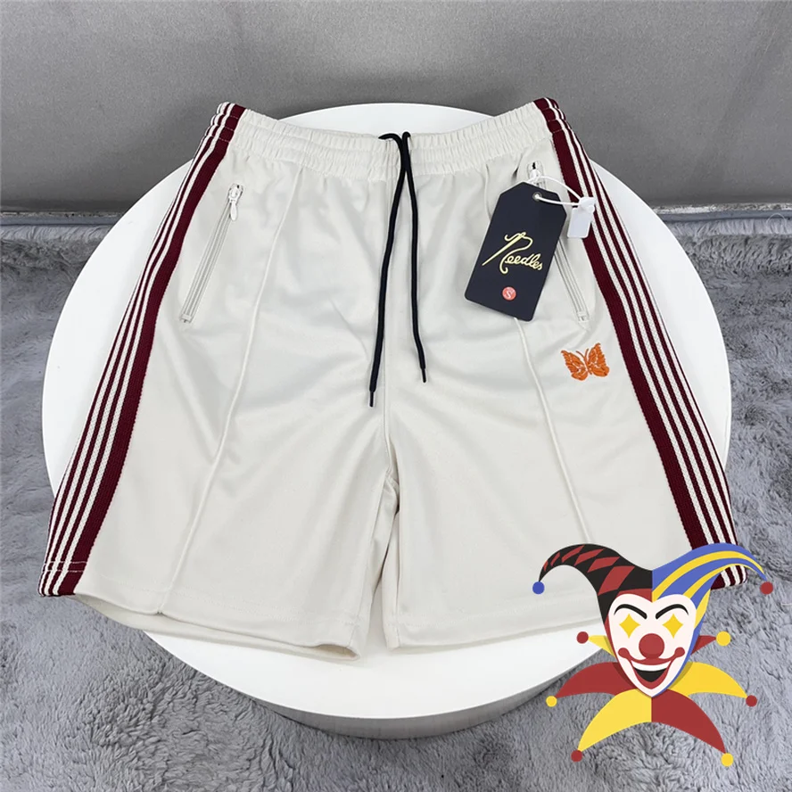 

Brown Stripes Needles Mesh Shorts Men Women High Street Needles Shorts Orange Embroidery Butterfly Logo AWGE Track Breeches