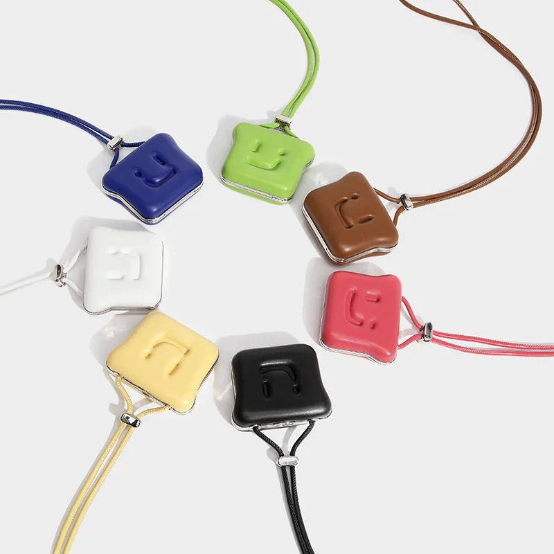 

2022 INS Candy Color Klein Blue Cute Smiley Face Mini Cookie Earphone Case Neck Ornament Change Key Earphone Storage Case