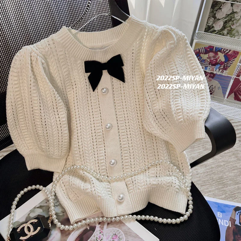 

OMCHION 2022 Summer New Korean Bubble Sleeve Hollowed Out Knitted Top Women Elegant Sweet Bow Sweater Chic Office Lady Pullover