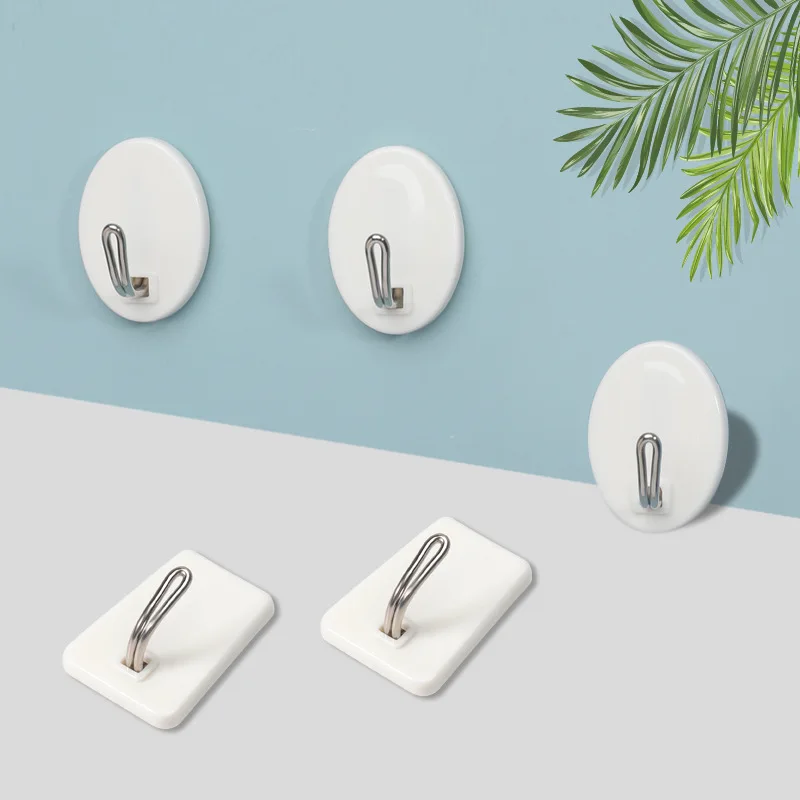 

White plastic trapezoidal oval small stick hook wall hanging objects thickened stick hook door rear hook behind the door