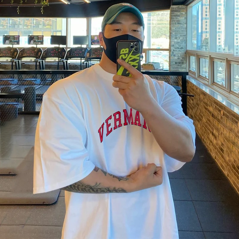 

New men's muscle fitness summer short sleeve solid color cotton loose sports large round neck top fashion Casual T-shirt