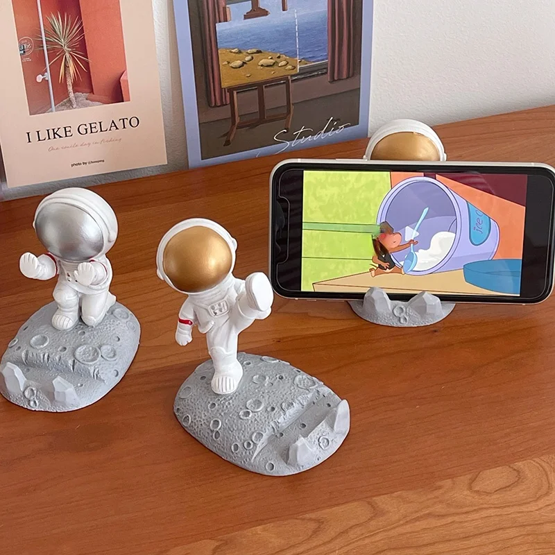 

Creative spaceman astronaut mobile phone holder lazy flat ipad support frame cute desktop decoration mobile phone holder