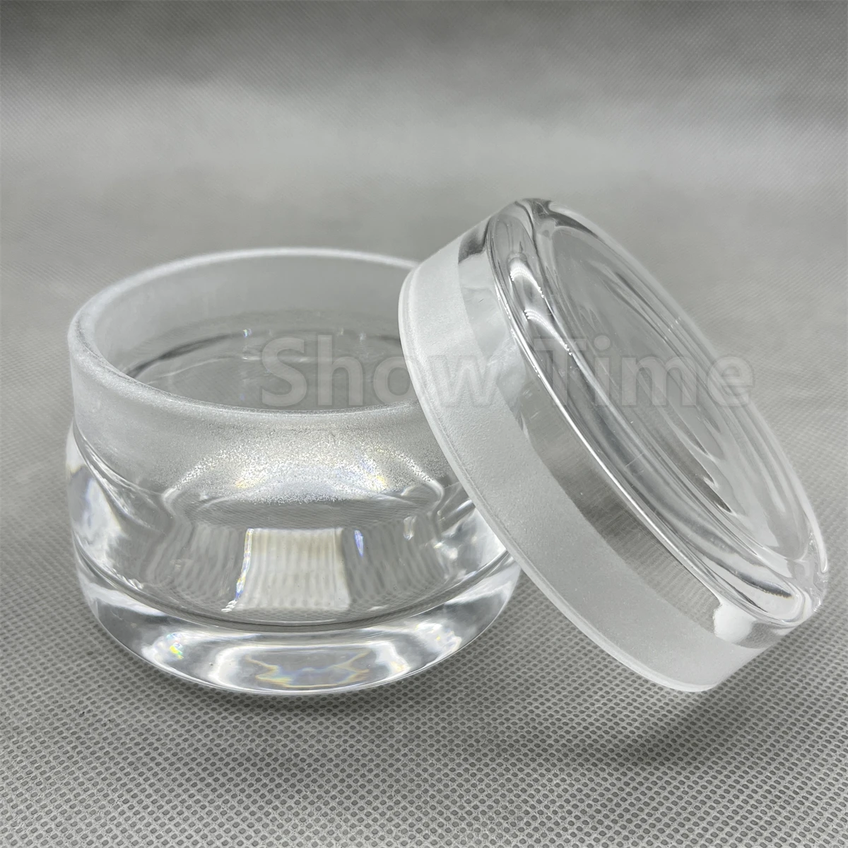 

Watch repair tool glass container contains cleaning solution for cleaning and maintenance of movement parts