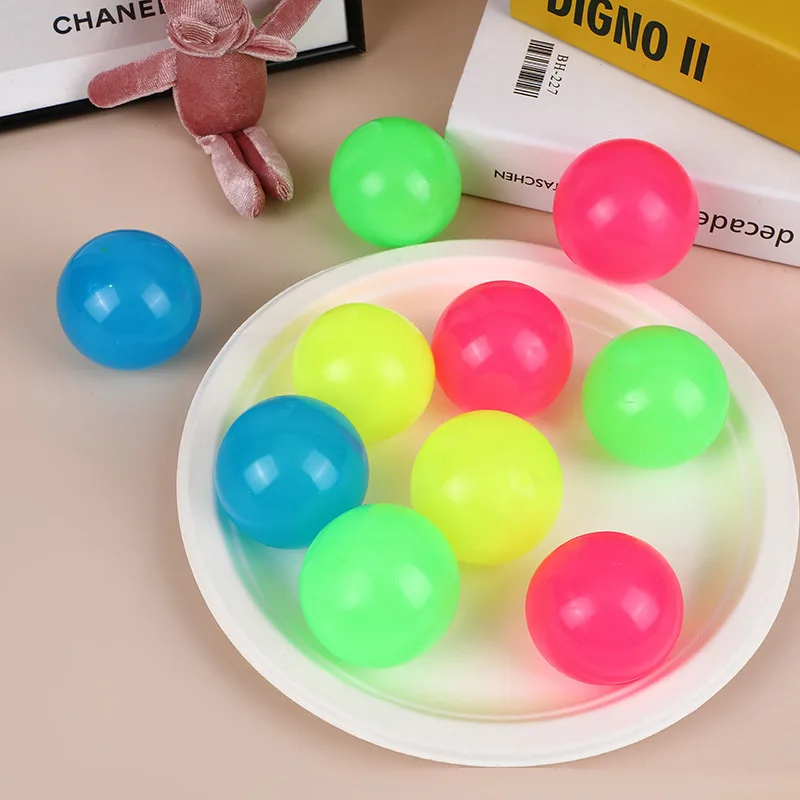 

4 Pieces Glowing Sticky Balls Elastic Squishy Balls Glow in the Dark Stick to the Ceiling Balls Fidget Toys Stress Ball