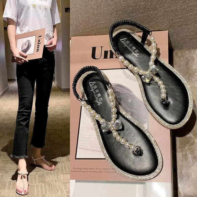 

2021 Summer Sweet Temperament Pearl One Word Buckle Open Toe Flat Sandals Female Students Set Toe Casual Roman Sandals