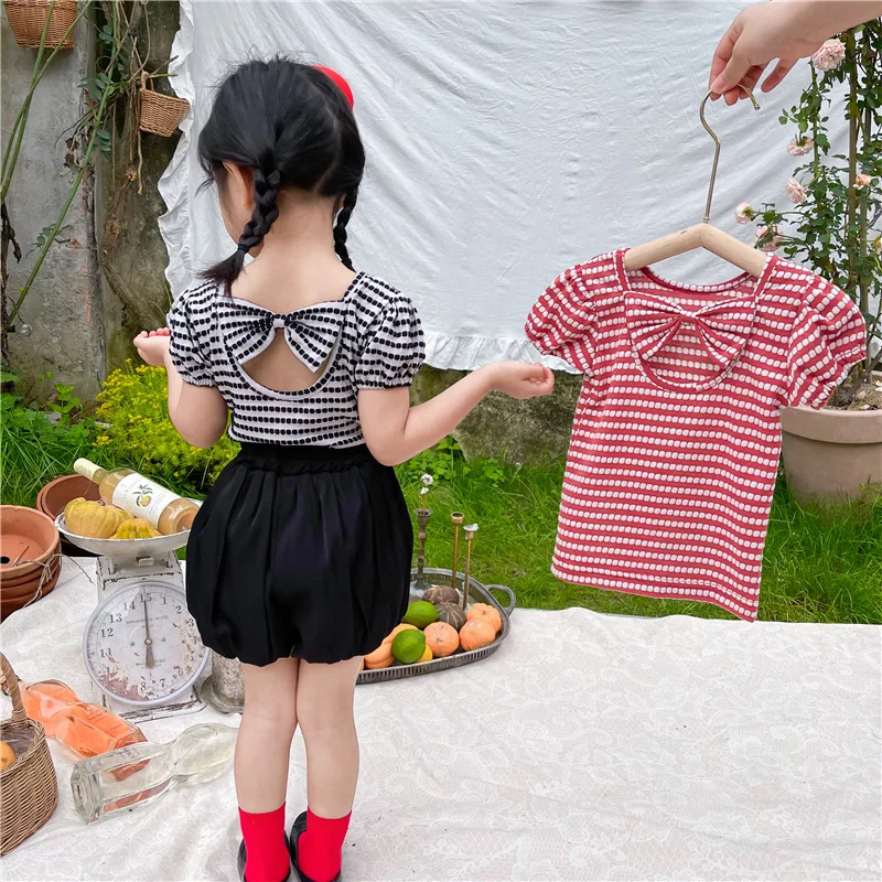 

Детская футболка с рукавами-фонариками, открытой спиной и бантом