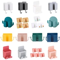 1pc wall mounted organizer storage box remote control mounted mobile phone plug wall holder charging multifunction holder stand