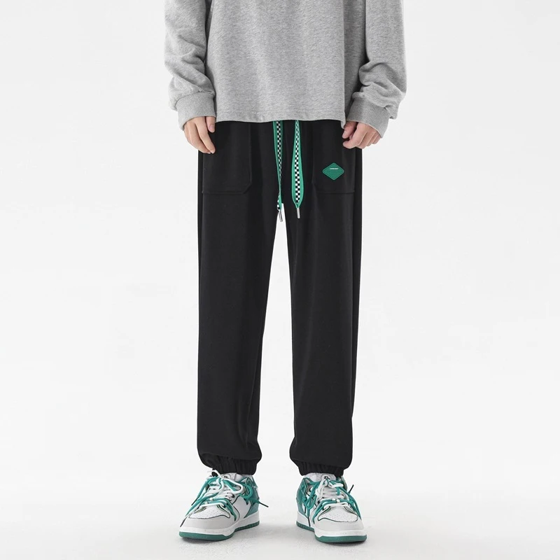 

TFETTERS Brand Couple Casual Sweatpants Korean Fashion Solid Loose Baggy Pants Men New Mid Elastic Waist Drawstring Sports Pants