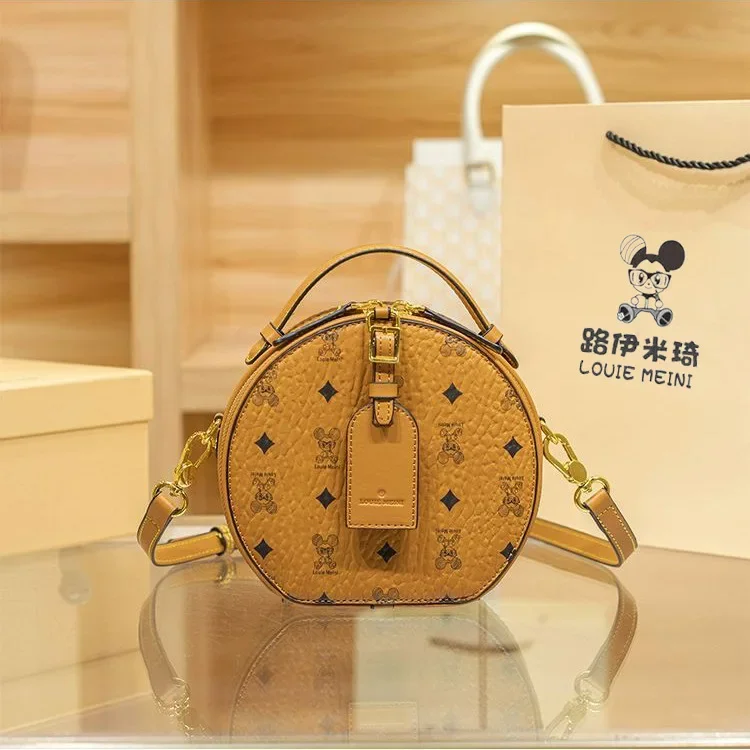

Luxury Brand Fashionable M Family Cartoon Versatile Compact Round Cake Bag High-end Feeling Handheld Crossbody Small Round Bag