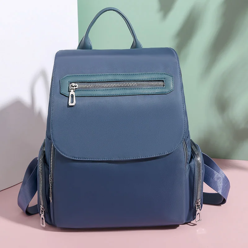 

Рюкзак женский из ткани «Оксфорд» с несколькими карманами и защитой от кражи