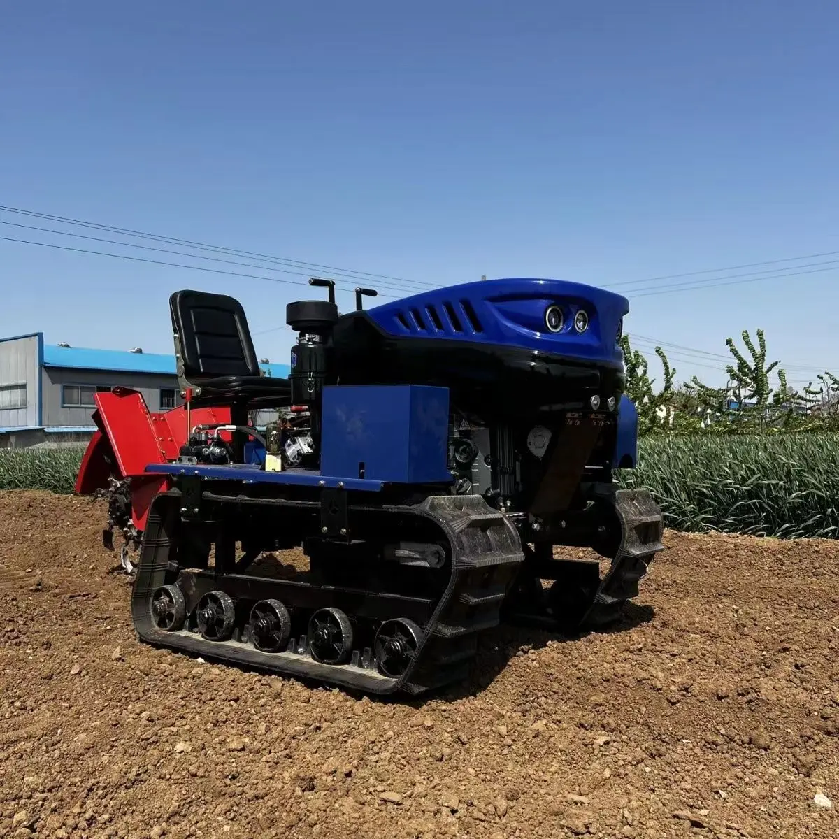 

Riding tracked rotary tiller for ditching, fertilizing, harvesting, and multifunctional four-wheel drive micro tillage