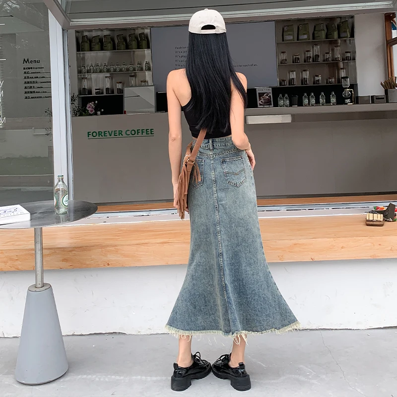 Denim skirt women's summer blue long skirt commuting new 2023 Korean version high waist niche loose bag hip raw edge fishtail