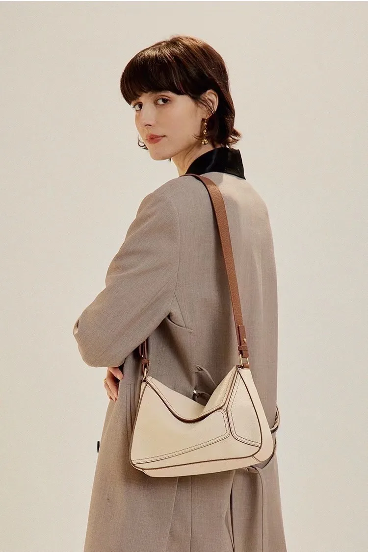 Commuter head layer cowhide geometric pillow bag 2022 new armpit leather women's bag niche design single shoulder crossbody bag