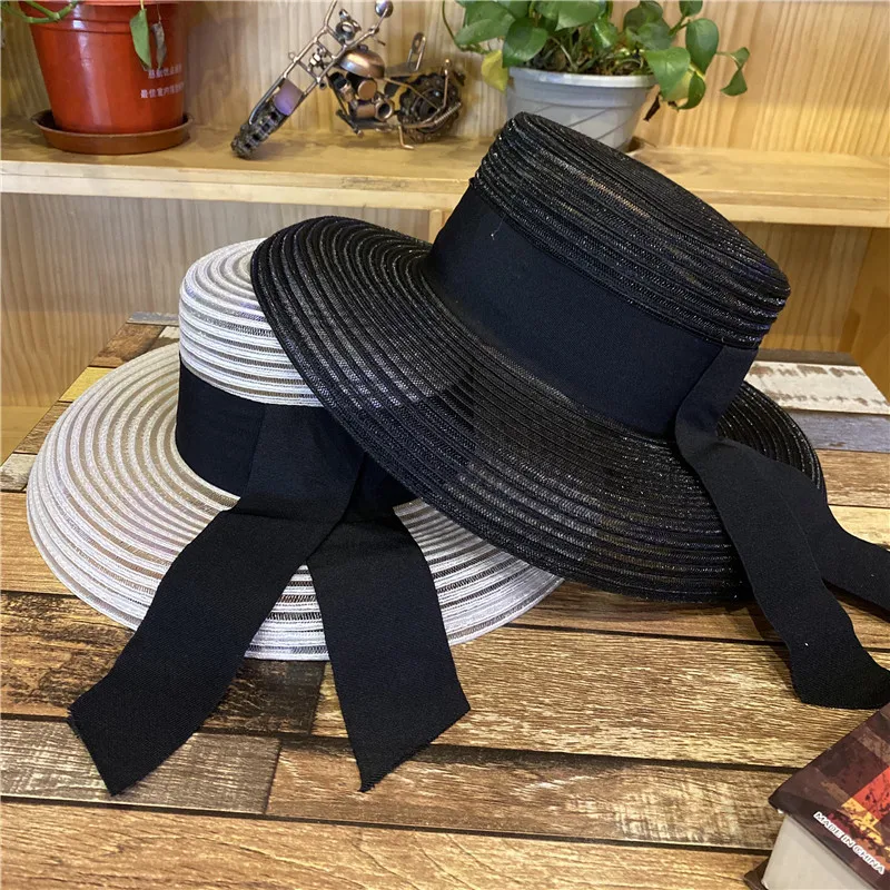 

New fashion Hepburn wind chimney cap han edition light straw hat big luxury joker eaves ribbon is prevented bask in UV sun hathi